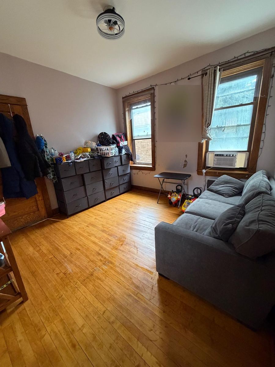 The same room tidied with clean hardwood floors
