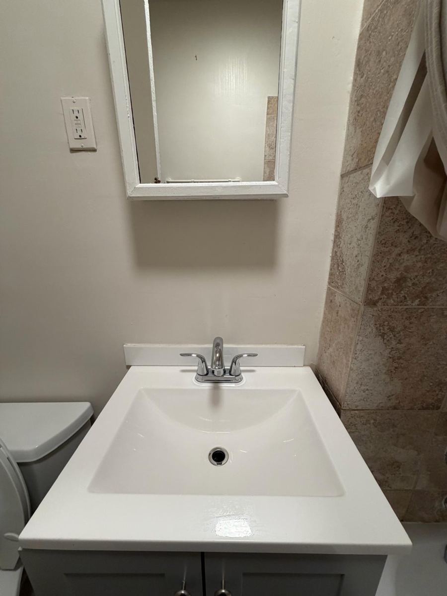 The same sink bright white with a shining faucet